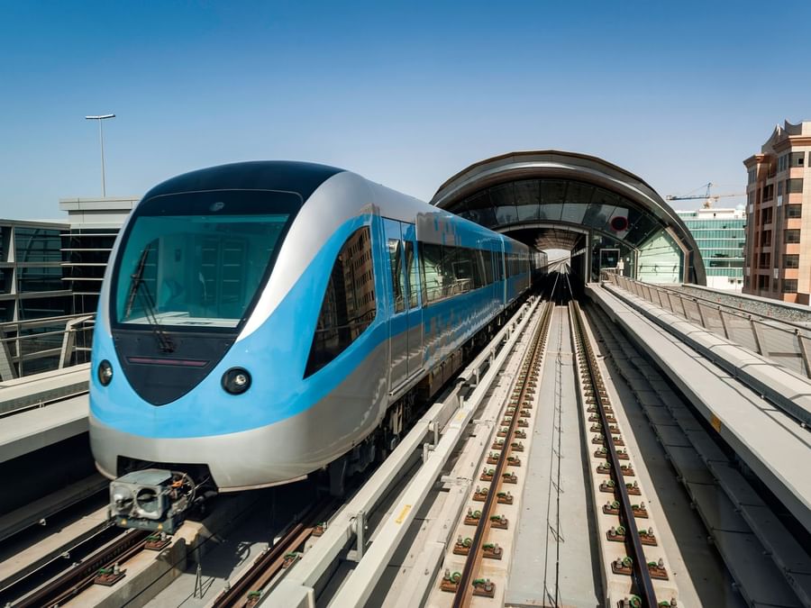 Modern train on an elevated track near DAMAC Hotels & Resorts, the best family hotels in Dubai