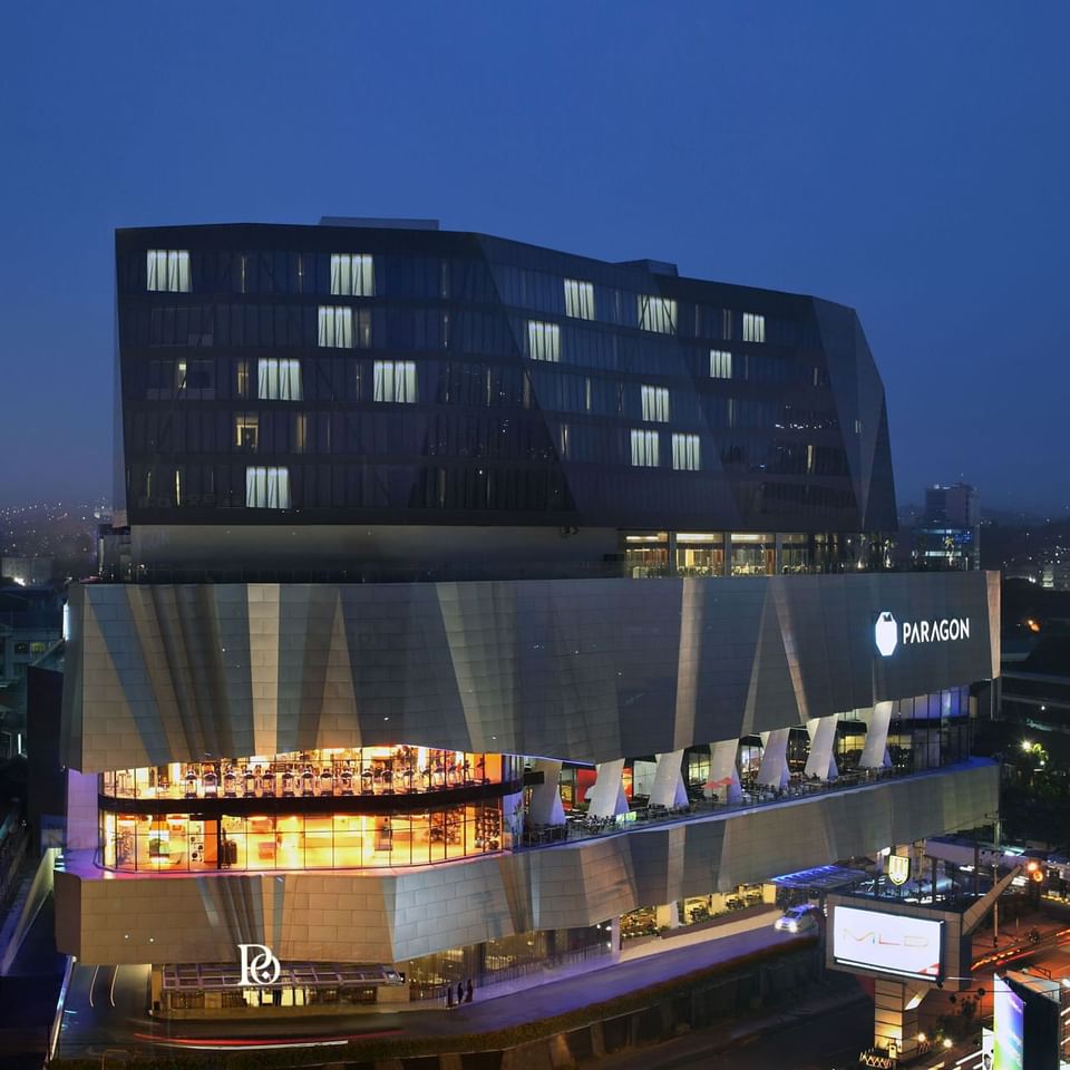 Exterior view of illuminated Po Hotel Semarang under the night sky