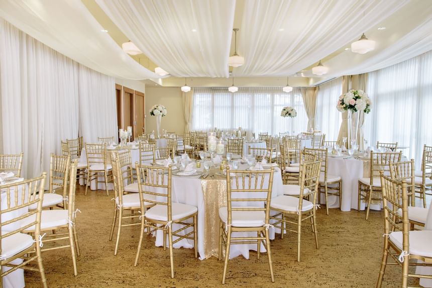 Event room with banquet tables & décor at Hotel Eldorado