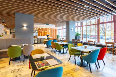 Dining tables, chairs and stylish hanging lights in Metro Jazz Bar & Bistro at Metropol Hotel
