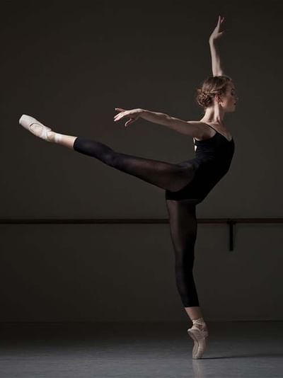 Ballet dancer performing an arabesque in a studio near Sofitel Brisbane Central