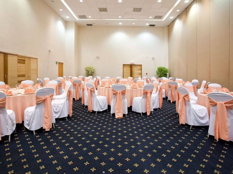 Banquet tables in Salon Zihuatl Room at Gamma Hotels