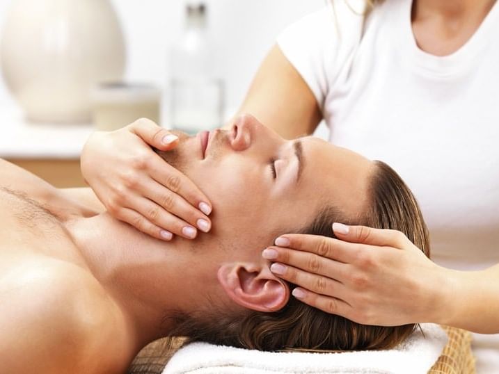 A gentleman getting a facial massage at Ana Hotels Europa