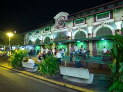 plaza with people hanging out at night