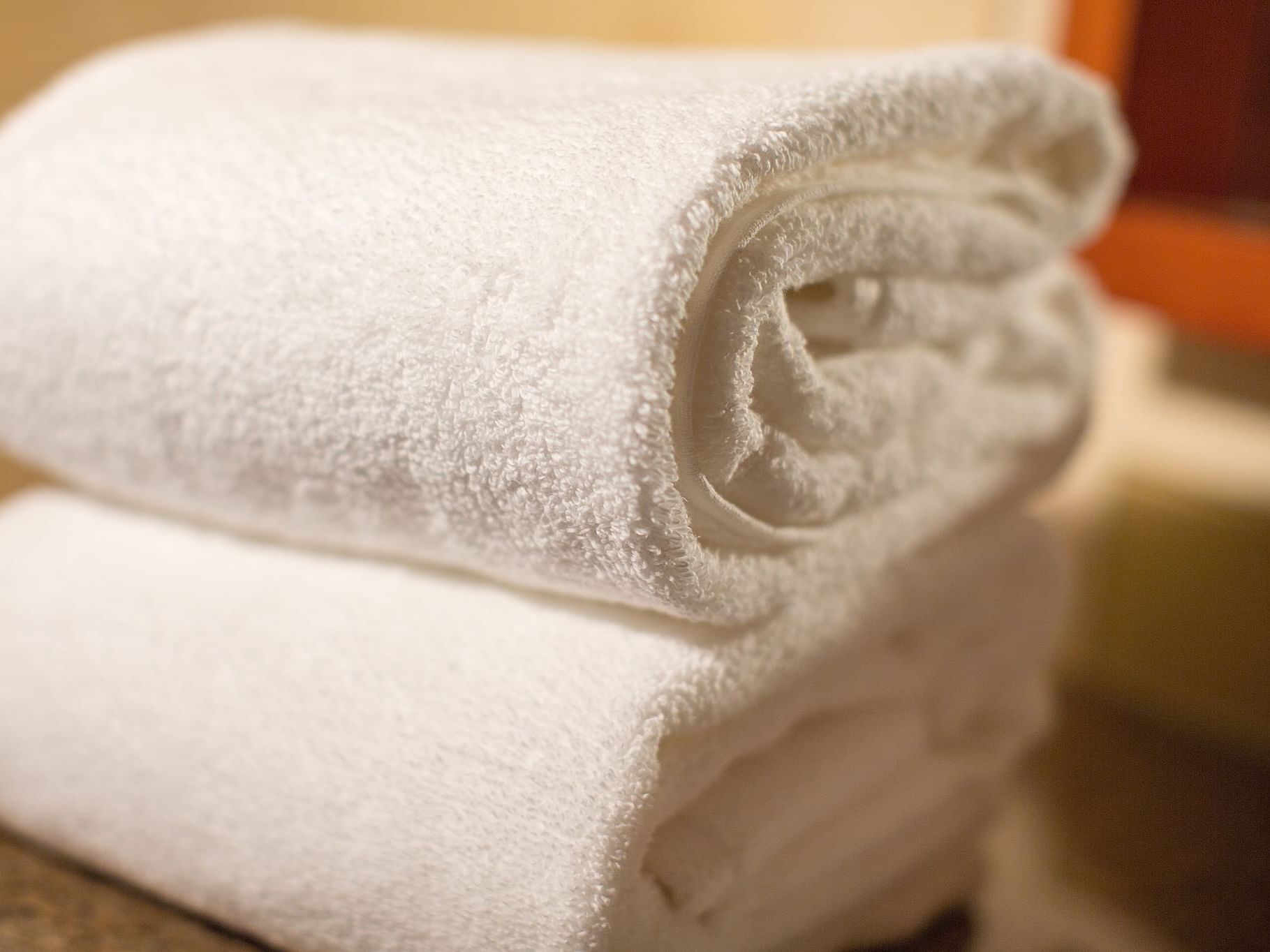 White towels roll up on a table at Paramount Hotel Seattle
