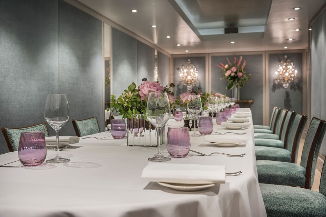 Mirror reflecting a beautifully arranged dining table in The Eaton 3 at The Capital Hotel, Apartments and Townhouse