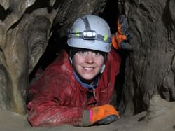 A man inside Canmore Caves near Blackstone Mountain Lodge