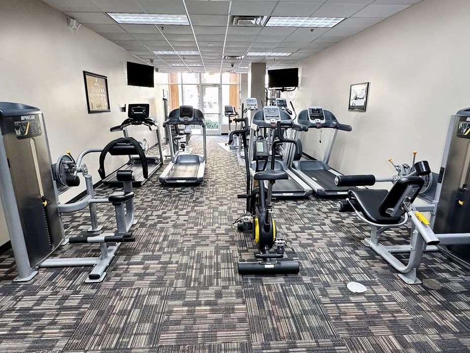 A well-equipped fitness center with various exercise machines.