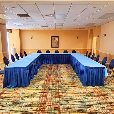 U-shaped table set-up in a meeting room with carpeted floors at Lake Buena Vista Resort Village & Spa