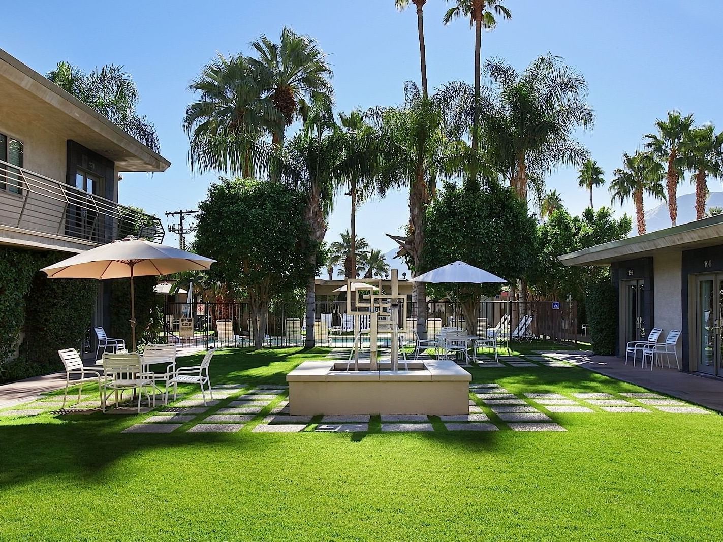 Outdoor Courtyard with dining setup at 7 Springs Inn & Suites