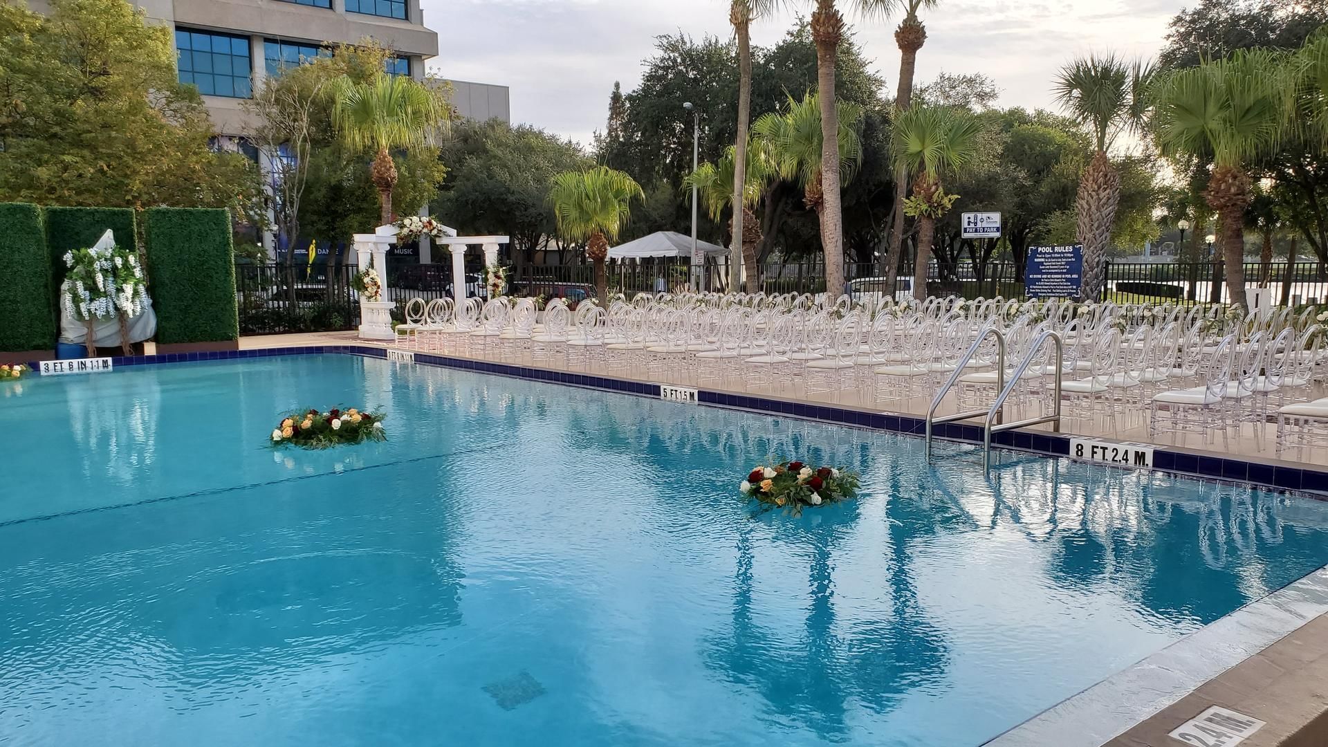 Outdoor wedding chair arrangement next to the pool area at The Barrymore Hotel