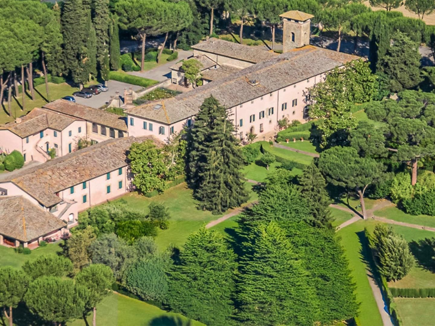 Aerial view of Relais San Clemente with gardens, tall trees, and neat lawns near AG Hotels