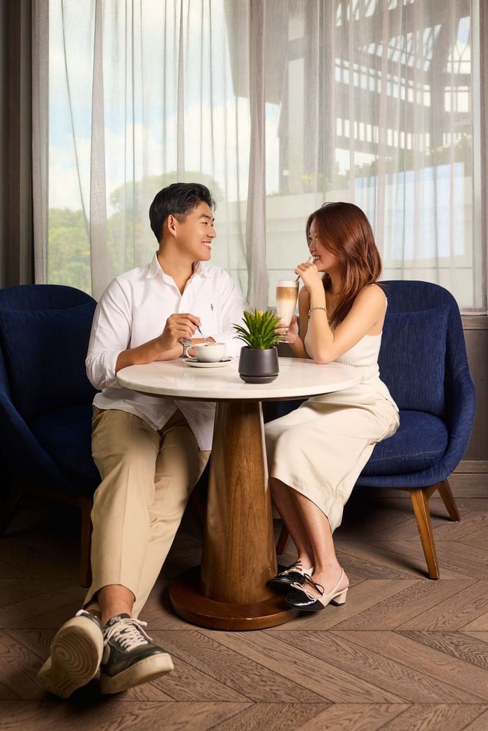 A tranquil morning at Grand Park City Hall, featuring a shared breakfast for two by the window.