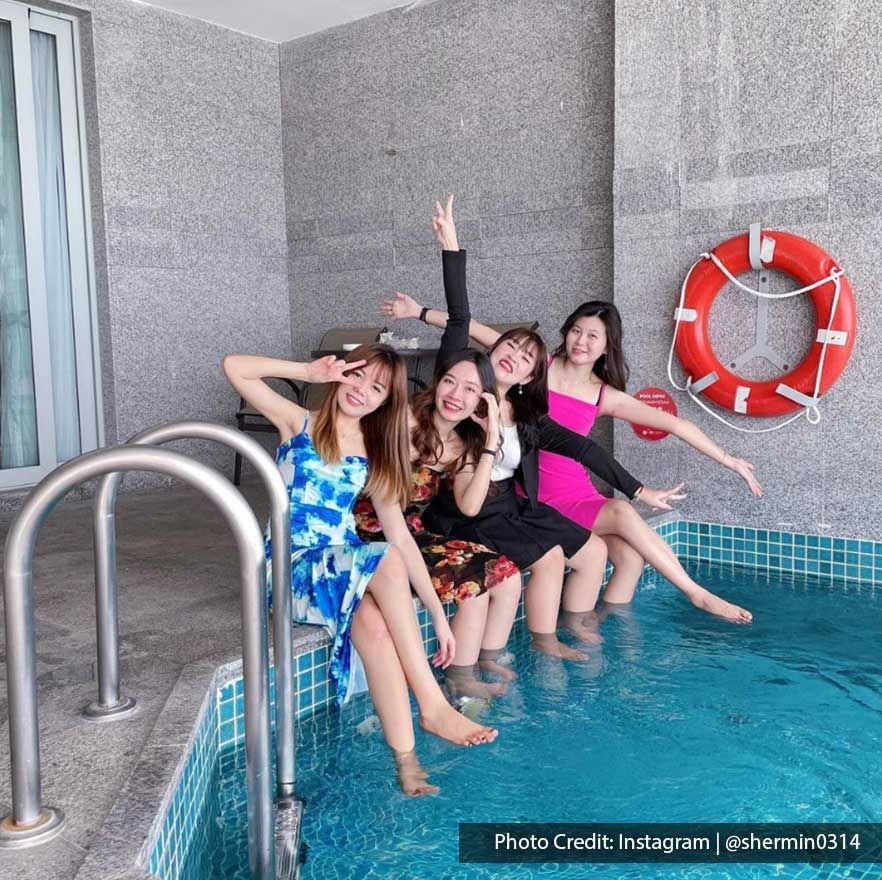 ladies having fun by poolside at Lexis Hotel