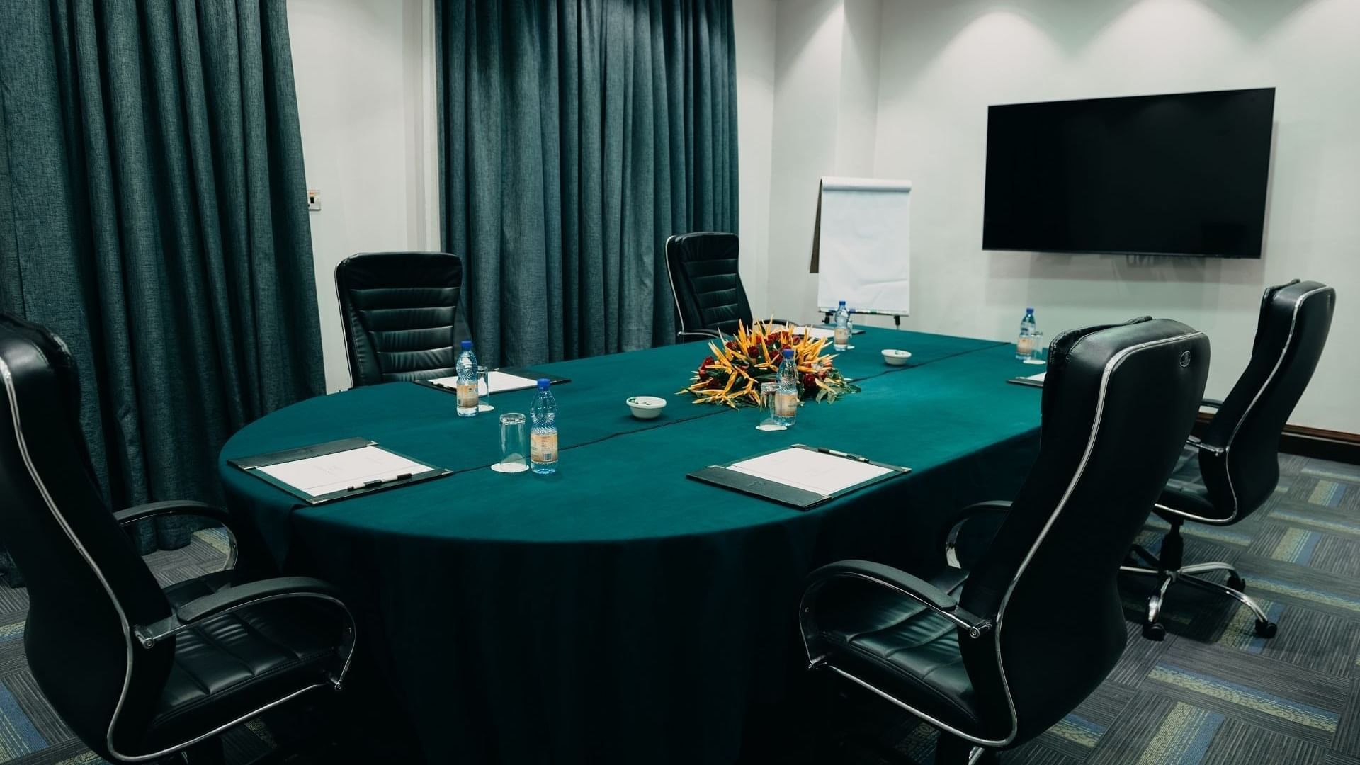 Bukasa Board Room with table and chairs at Lake Victoria Serena Golf Resort & Spa in Kampala.
