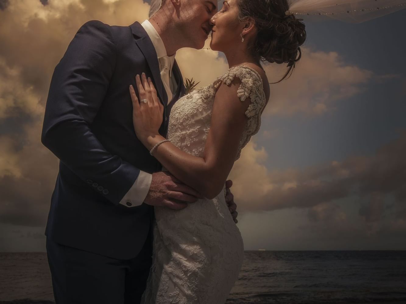 Close up of wedded couple posing at Haven Riviera Cancun