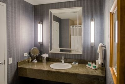 Bathroom vanity in Deluxe King Corner Room at Kinzie Hotel