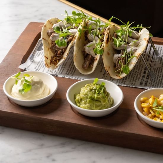 Tray with tacos served on a table in BAR THIRTY6 at Pullman Sydney Hyde Park