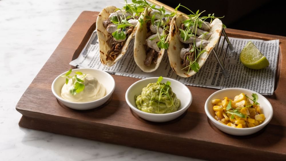Tray with tacos served on a table in BAR THIRTY6 at Pullman Sydney Hyde Park