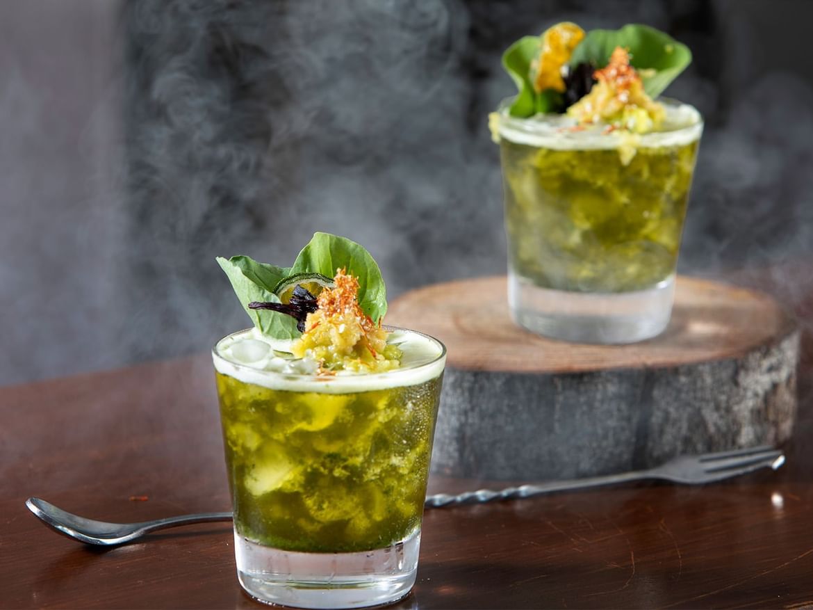 Two Cocktail glasses on a table in Coco Bar at Senses Hotel