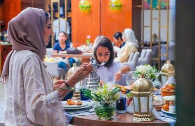 A family dining at the Seasons Restaurant in Bay La Sun Hotel & Marina