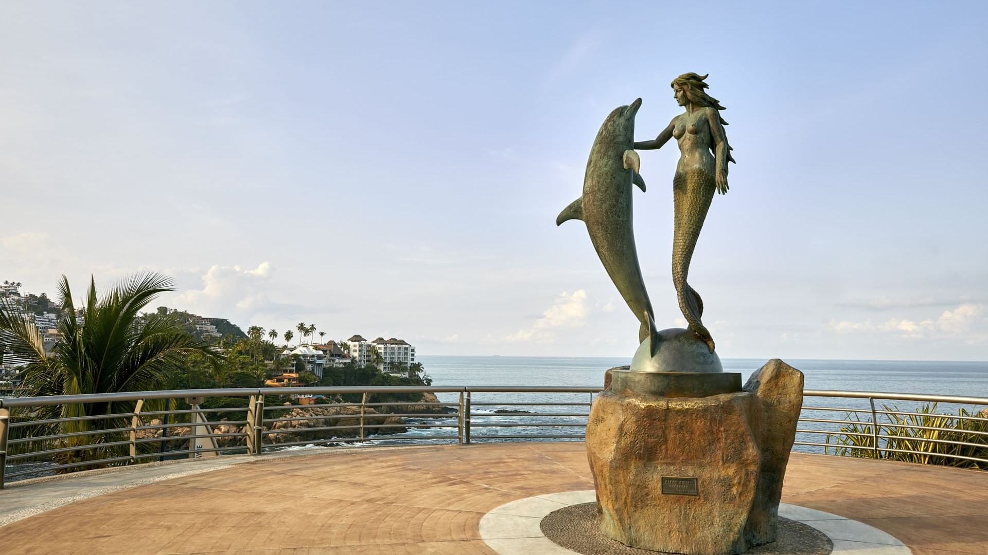 Mermaid & dolphin statue near One Acapulco Diamante