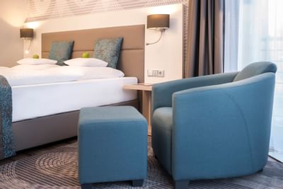 Sofa chair in standard room in Hotel Collegium Leoninum, Bonn