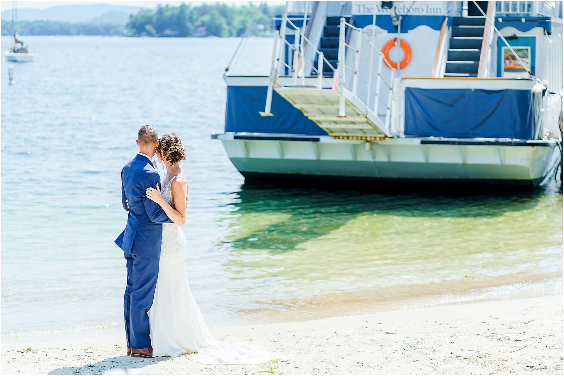 Bride and Groom posing outdoors by ship at Wolfeboro Inn