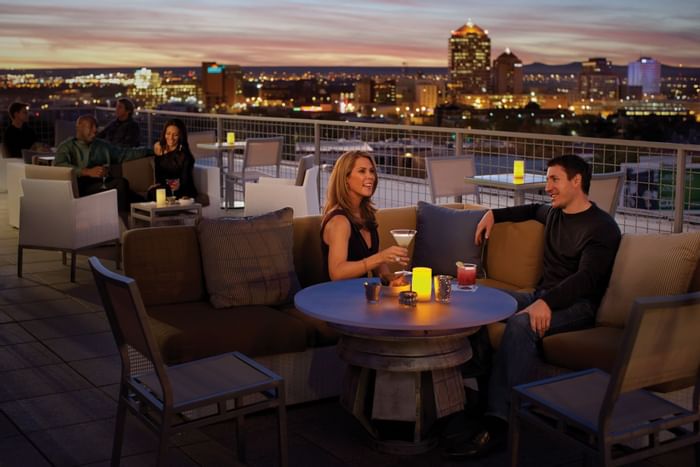People drinking on rooftop lounge bar