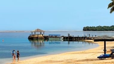 Landscape view of a deck by the beach at Warwick Fiji