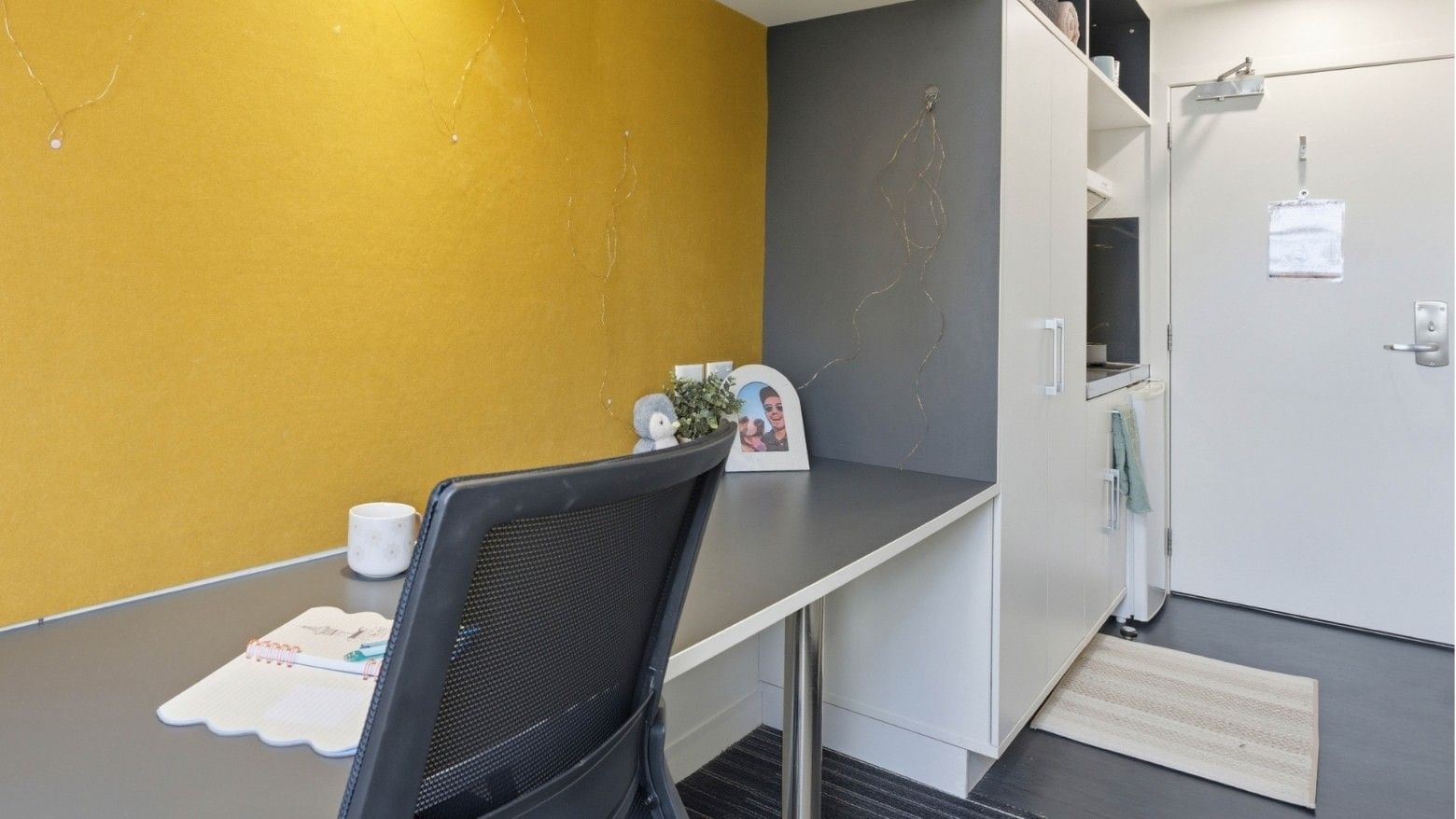 Work area with a desk and chair at UniLodge Auckland City.