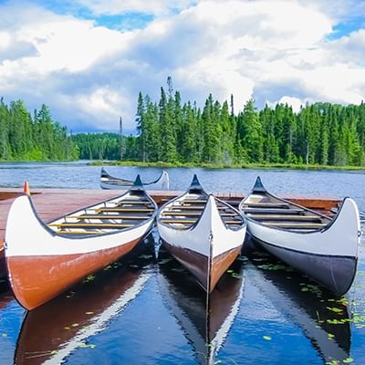 three canoes in a lake