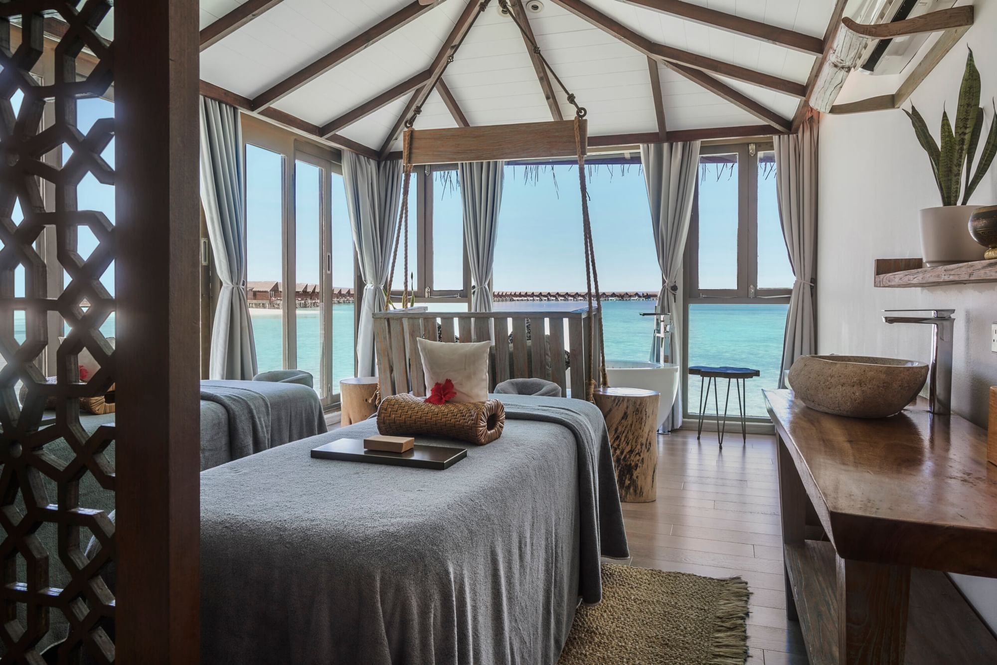 Massage beds with amenities in the Spa at Grand Park Kodhipparu, Maldives