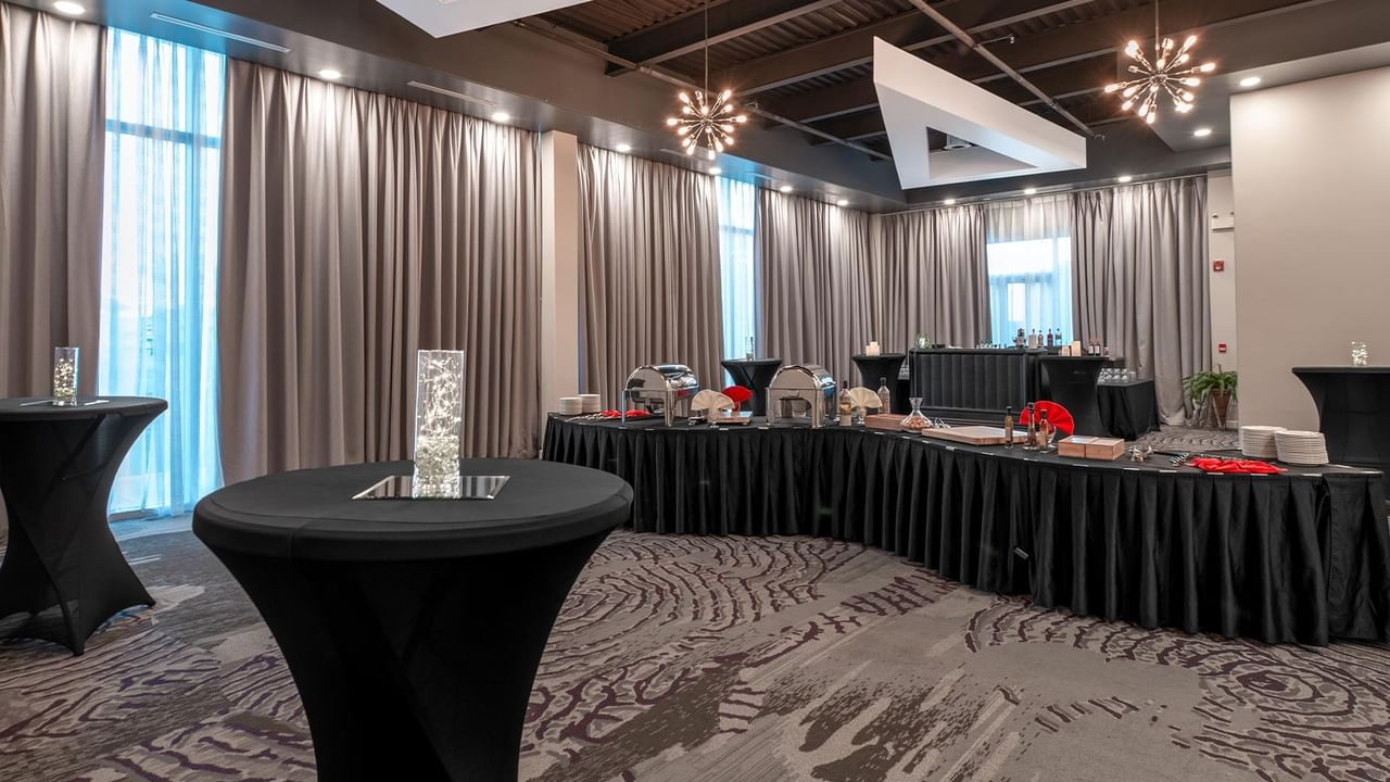 Elegantly set banquet tables with decor.