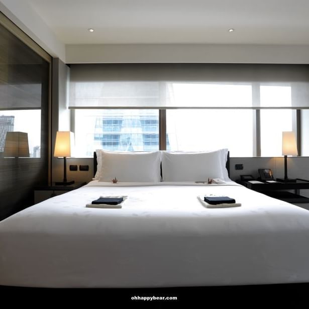 King bed in Deluxe room at Okura Prestige Bangkok