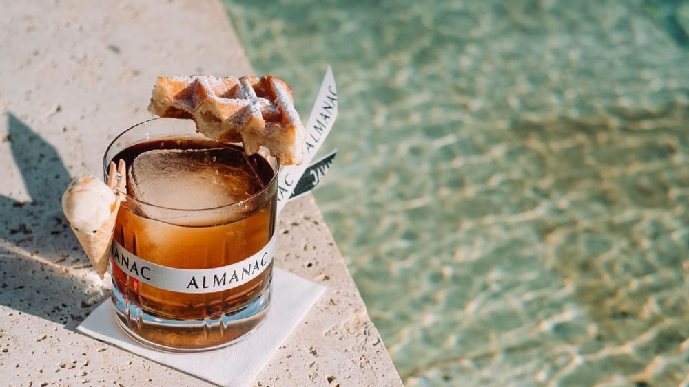 Azimuth Rooftop Bar Cocktail with a Waffle at Almanac Group