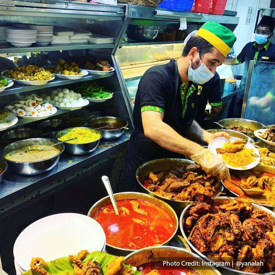 the staff at Hameediyah Nasi Kandar Restaurant were busy preparing nasi kandar to serve to the customer