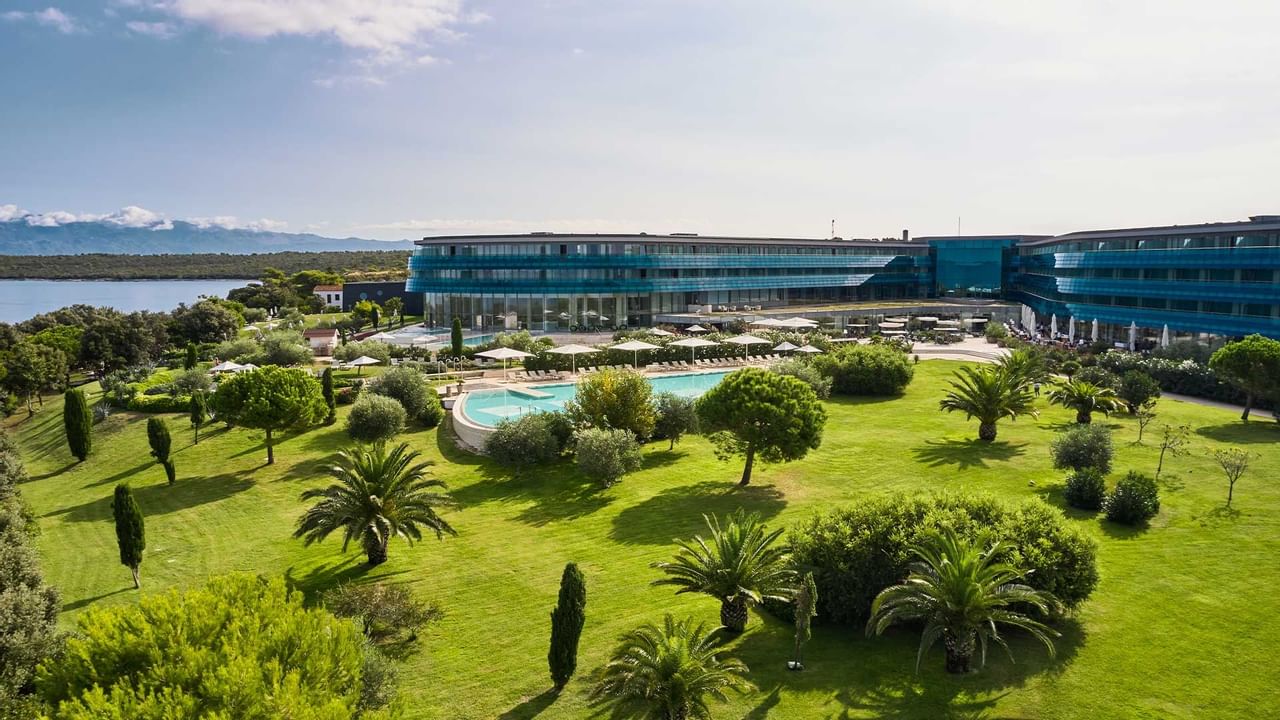 Garden & outdoor pool at Falkensteiner Resort Punta Skala