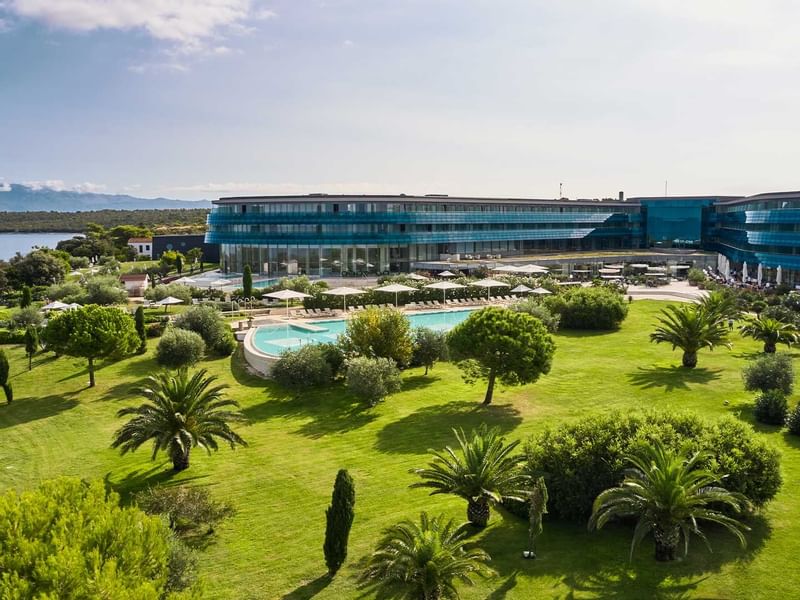 Garden & outdoor pool at Falkensteiner Resort Punta Skala