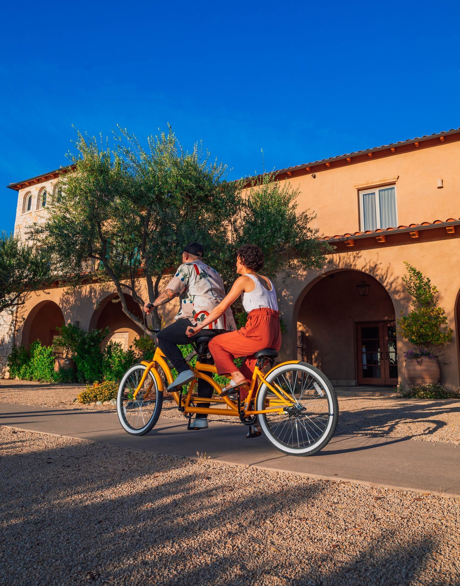 Lorem ipsum Man and woman riding a tandem bike