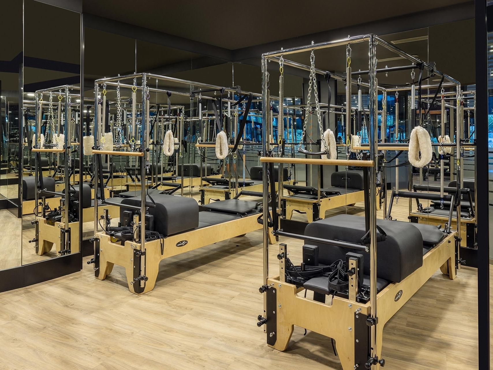 A mirrored gym equipped with Pilates machines at Titanic Luxury Collection Bodrum.