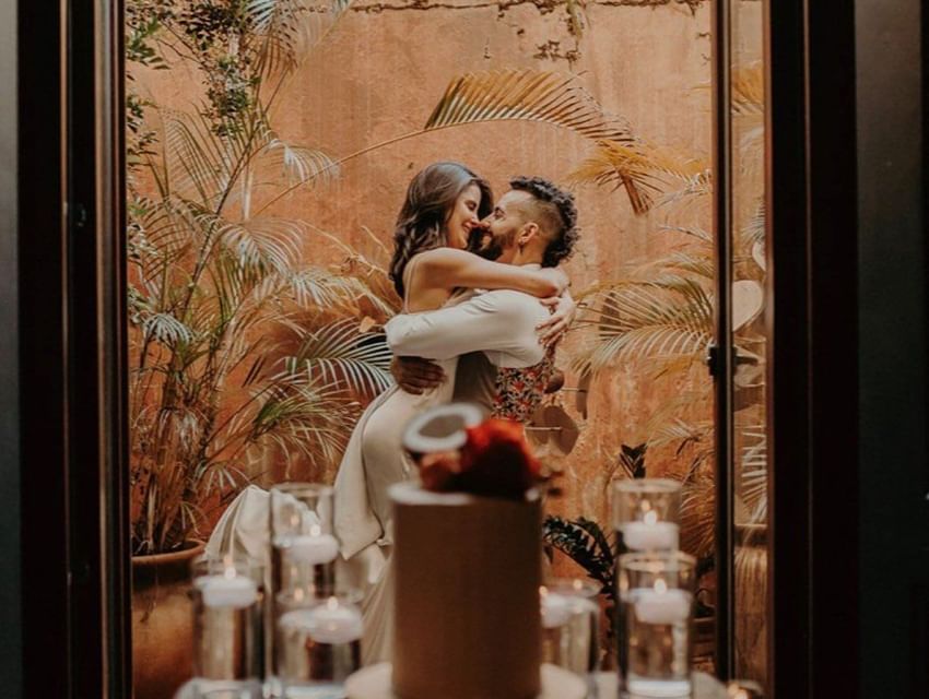 Couple posing for a photo near Hotel El Convento