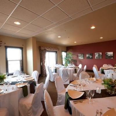 Banquet table setup in an event room at Chase on The Lake