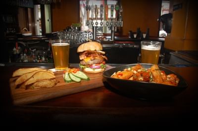 burger, fries, draft beer and wings