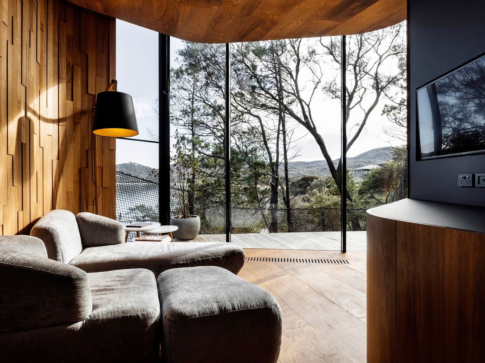 TV lounge area overlooking the mountains in the Coastal Pavilion at Freycinet Lodge