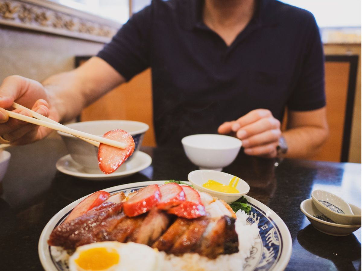 Close-up of a man dining a breakfast meal at Park Hotel Hong Kong