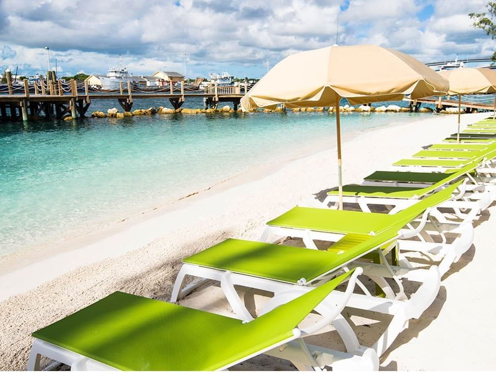 Sunbeds and sun huts by the beach near Warwick Paradise Island Bahamas
