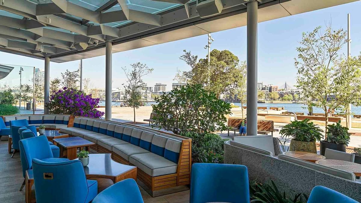 Open-air dining area with plush seating in CIRQ at Crown Towers Sydney