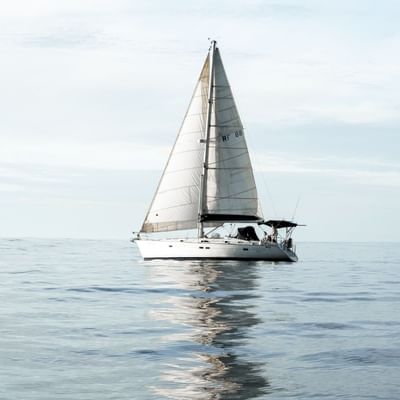 A lone yacht on the sea near Falkensteiner Hotels