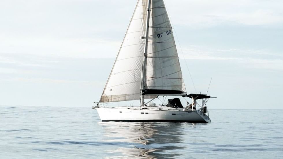 A lone yacht on the sea near Falkensteiner Hotels